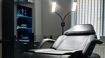 Luxurious treatment chair at MÉRA LUXE CLINIC, Pontypool, Wales, GB, lit stylishly for wellness sessions.
