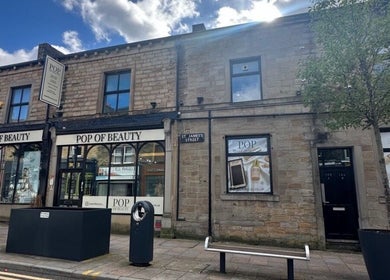 Street view of a beauty venue near Aisha Advanced Skincare, Burnley, England, GB on St James's Street.