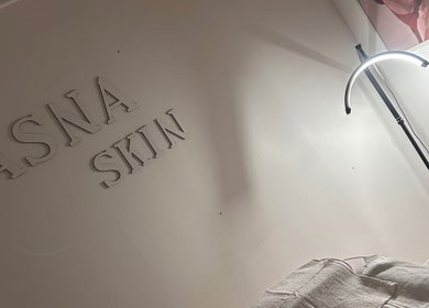 Cozy skincare corner in Aisha Advanced Skincare, Nelson, England, GB with minimalist decor and soft lighting.