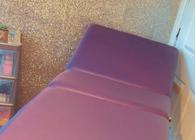 Luxury treatment bed at K & A Nails and Beauty, Hednesford, England, GB with a sparkly gold wall.