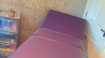 Luxury treatment bed at K & A Nails and Beauty, Hednesford, England, GB with a sparkly gold wall.
