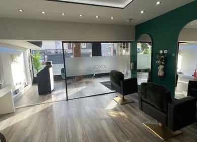 Modern interior of K&A Nails and Beauty, Cannock, England, GB, featuring chic seating and elegant mirrors.