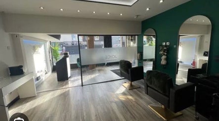 Modern interior of K&A Nails and Beauty, Cannock, England, GB, featuring chic seating and elegant mirrors.