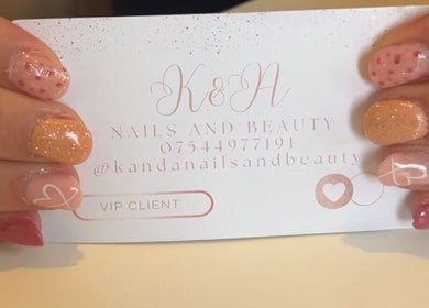 Stylish nails holding K&A Nails and Beauty card in Cannock, England, GB. Vibrant nail designs and VIP service.