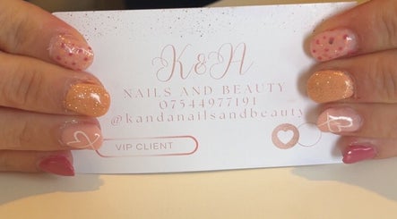 Stylish nails holding K&A Nails and Beauty card in Cannock, England, GB. Vibrant nail designs and VIP service.