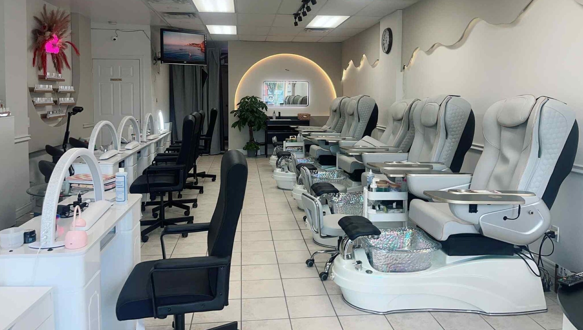 Luxurious pedicure chairs and manicure stations at Bloomie Nails and Spa in Toronto, Ontario, CA.