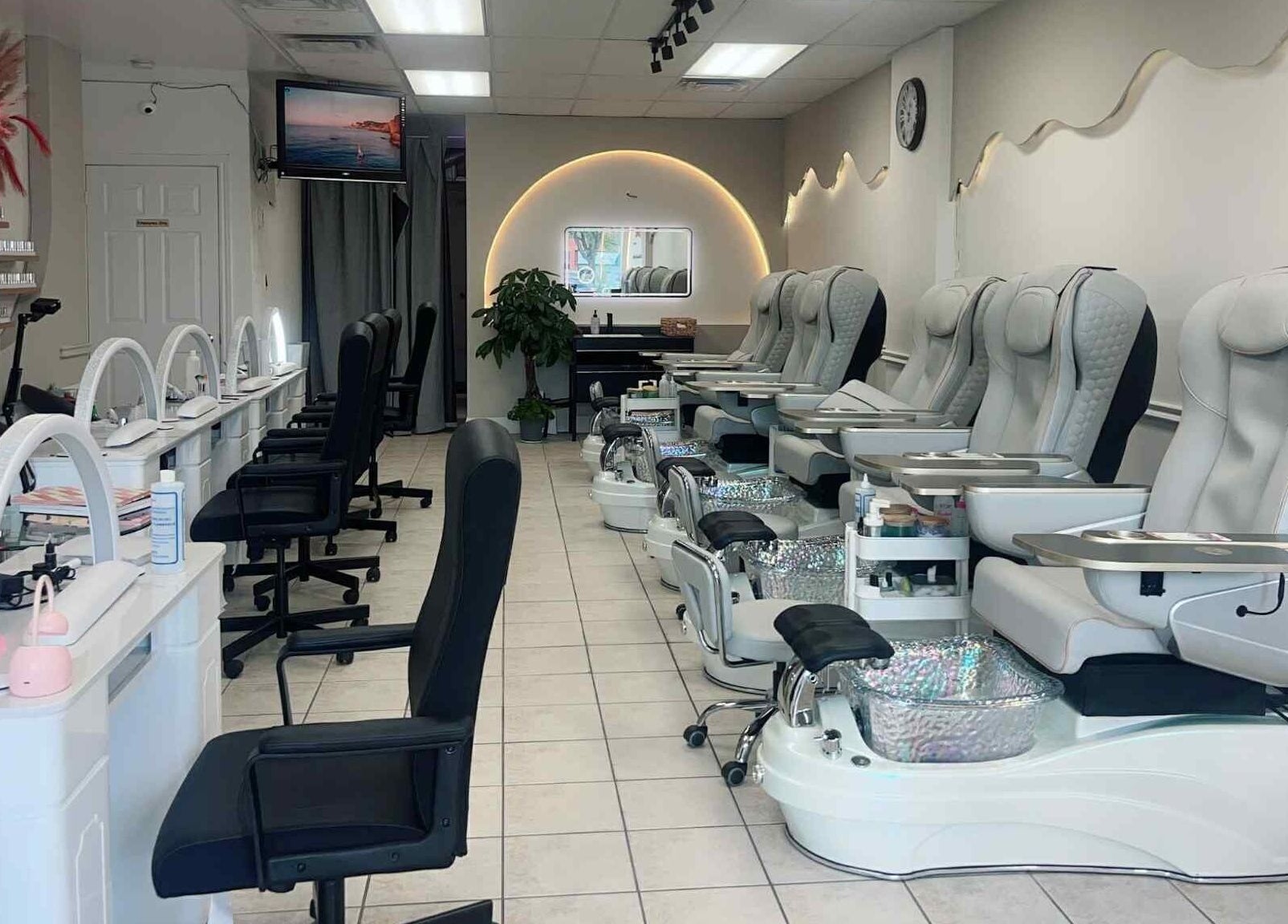 Luxurious pedicure chairs and manicure stations at Bloomie Nails and Spa in Toronto, Ontario, CA.