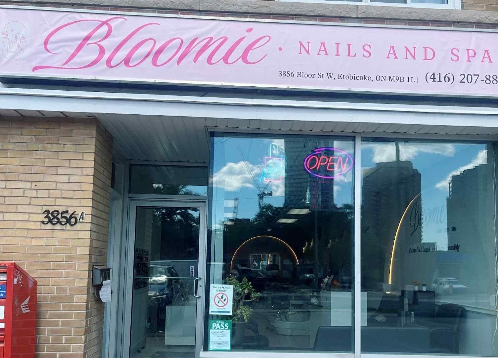 Front view of Bloomie Nails and Spa in Toronto, Ontario, CA showcasing its stylish entrance and signage.