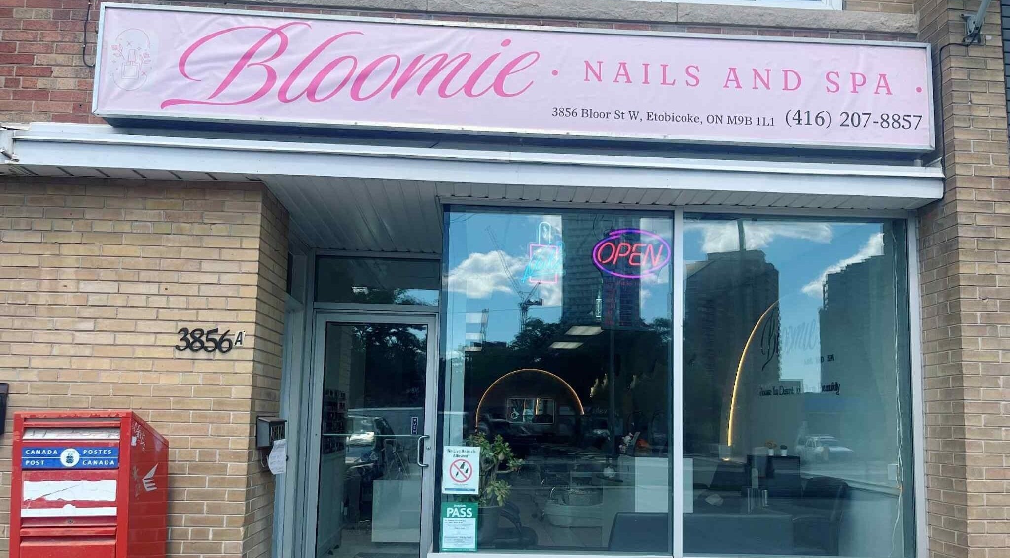 Front view of Bloomie Nails and Spa in Toronto, Ontario, CA showcasing its stylish entrance and signage.