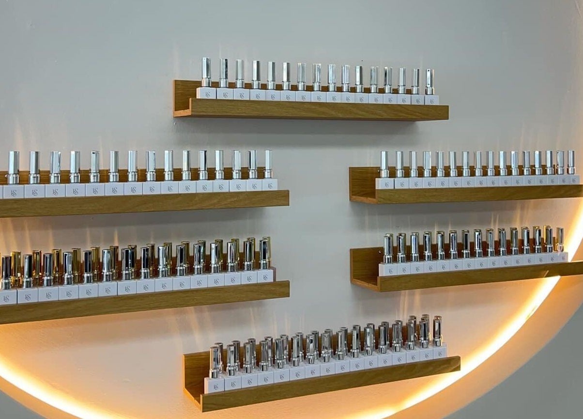 Elegant nail polish display at Bloomie Nails and Spa, Toronto, Ontario, CA showcasing diverse color selections.