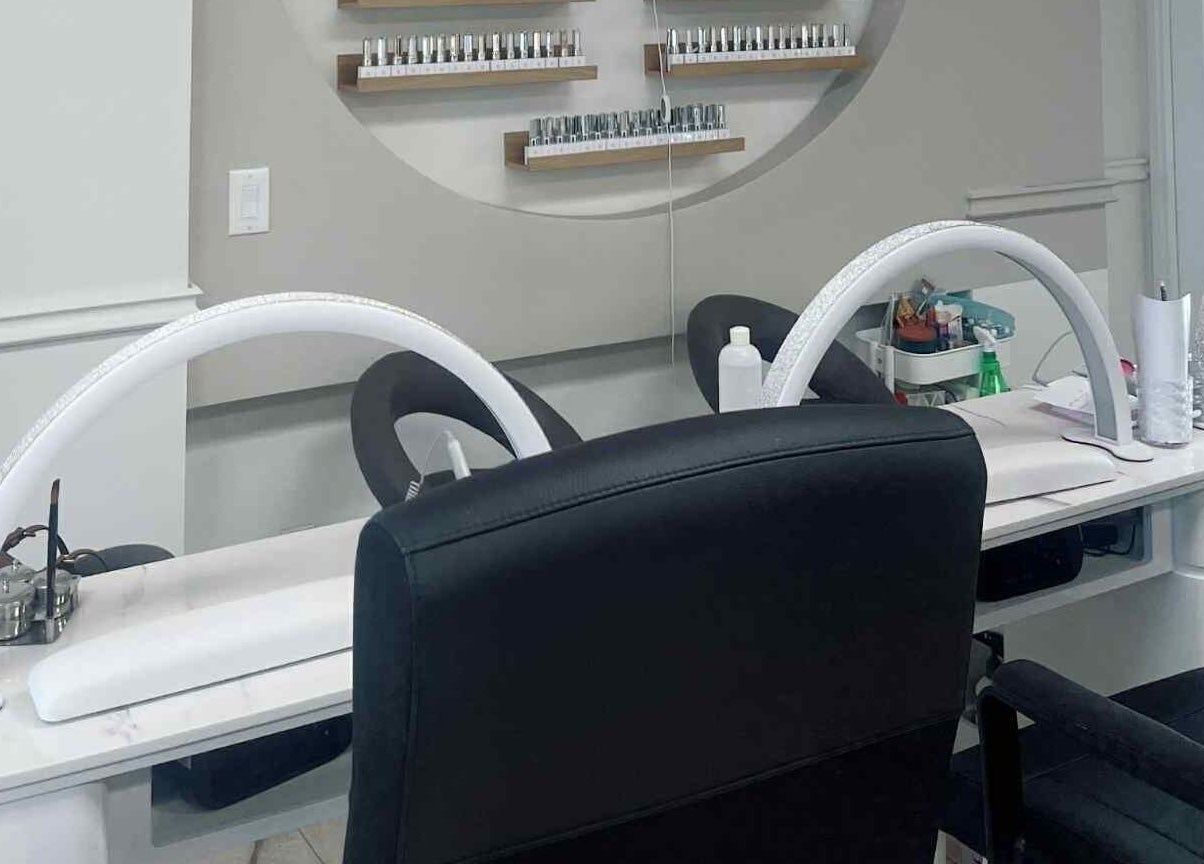 Stylish nail stations at Bloomie Nails and Spa, Toronto, Ontario, CA, showcasing sleek design and comfort.