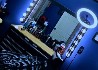 Elegant Quinnbarber styling area with mirror and products, Tulsa, Oklahoma, US.