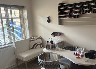 Modern nail station at Touch Of Beauty By Kathryn, Woodlands, England, GB, showcasing sleek decor and polish display.
