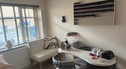 Modern nail station at Touch Of Beauty By Kathryn, Woodlands, England, GB, showcasing sleek decor and polish display.