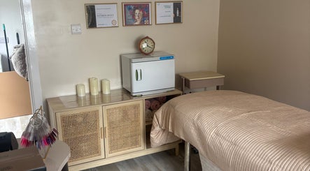 Relaxing spa room at Touch Of Beauty By Kathryn in Woodlands, England, GB featuring a cozy treatment bed and gentle lighting.