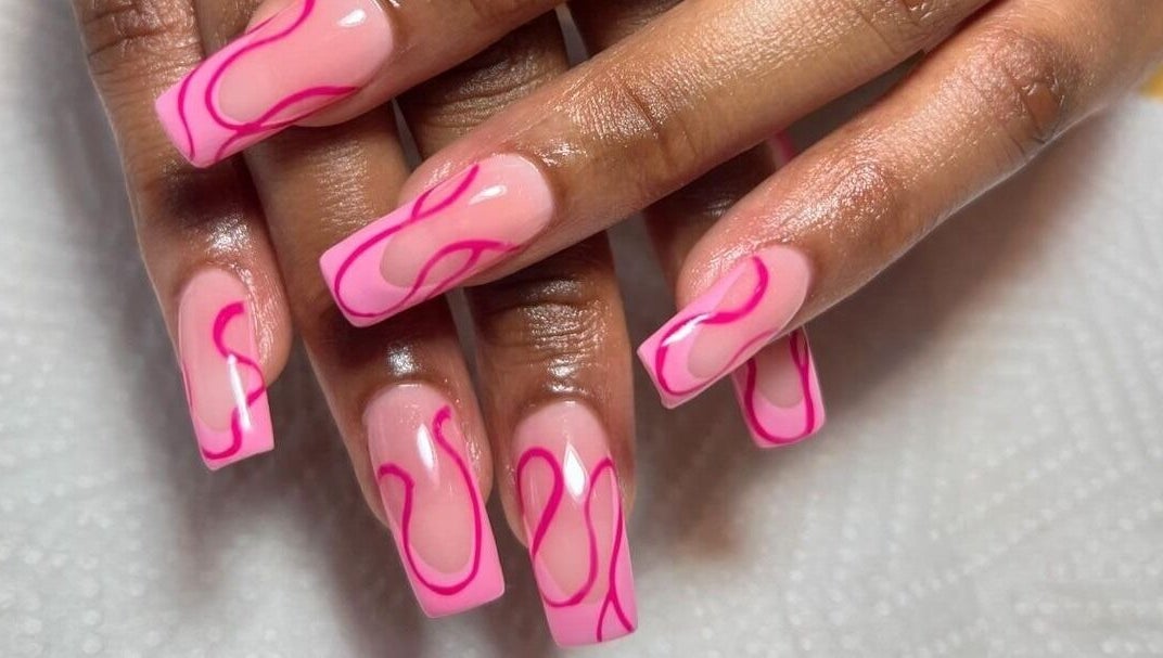 Stylish pink nails with vibrant designs at Naileen Beauty, Midrand, Gauteng, ZA.