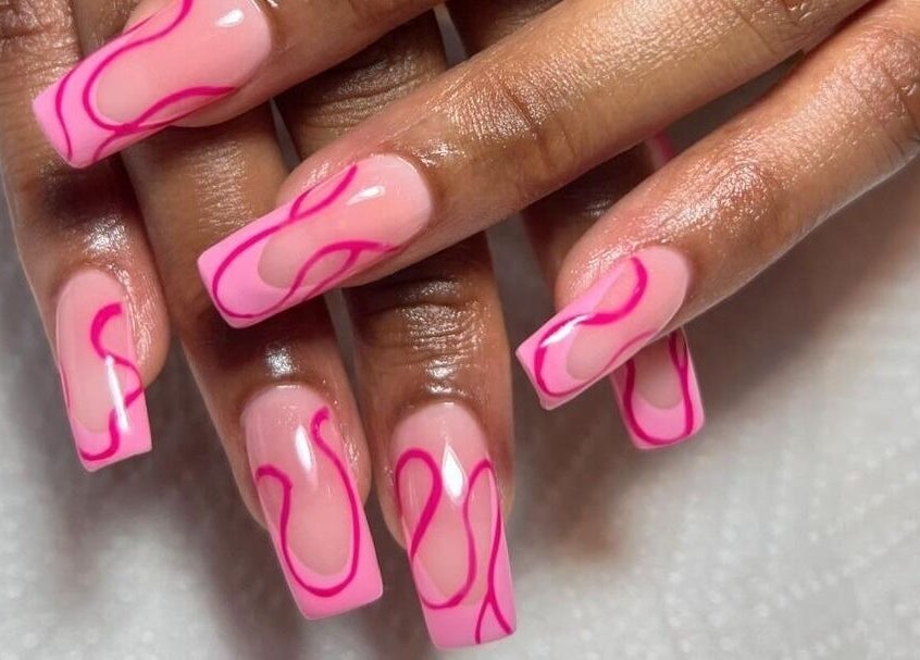 Stylish pink nails with vibrant designs at Naileen Beauty, Midrand, Gauteng, ZA.