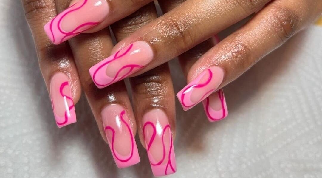 Stylish pink nails with vibrant designs at Naileen Beauty, Midrand, Gauteng, ZA.