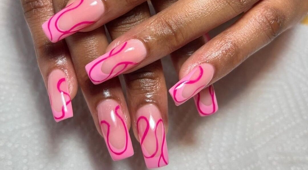 Stylish pink nails with vibrant designs at Naileen Beauty, Midrand, Gauteng, ZA.