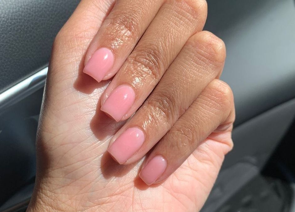 Manicured nails with pink polish at Naileen Beauty, Midrand, Gauteng, ZA.