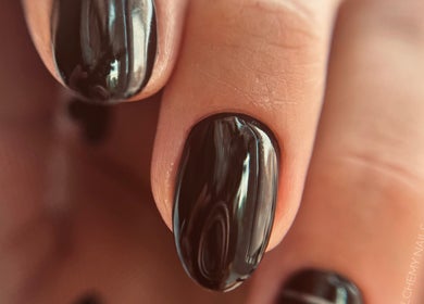 Close-up of elegant dark nails at Auric Alchemy Nails in Northampton, England, GB.