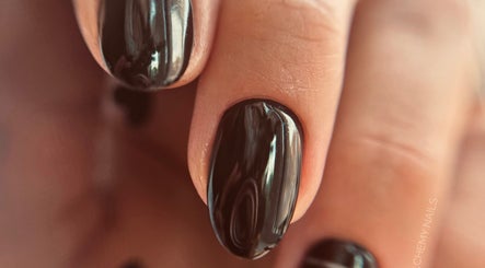 Close-up of elegant dark nails at Auric Alchemy Nails in Northampton, England, GB.