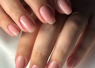 Elegant pink manicure showcasing glossy nails at Auric Alchemy Nails, Northampton, England, GB.