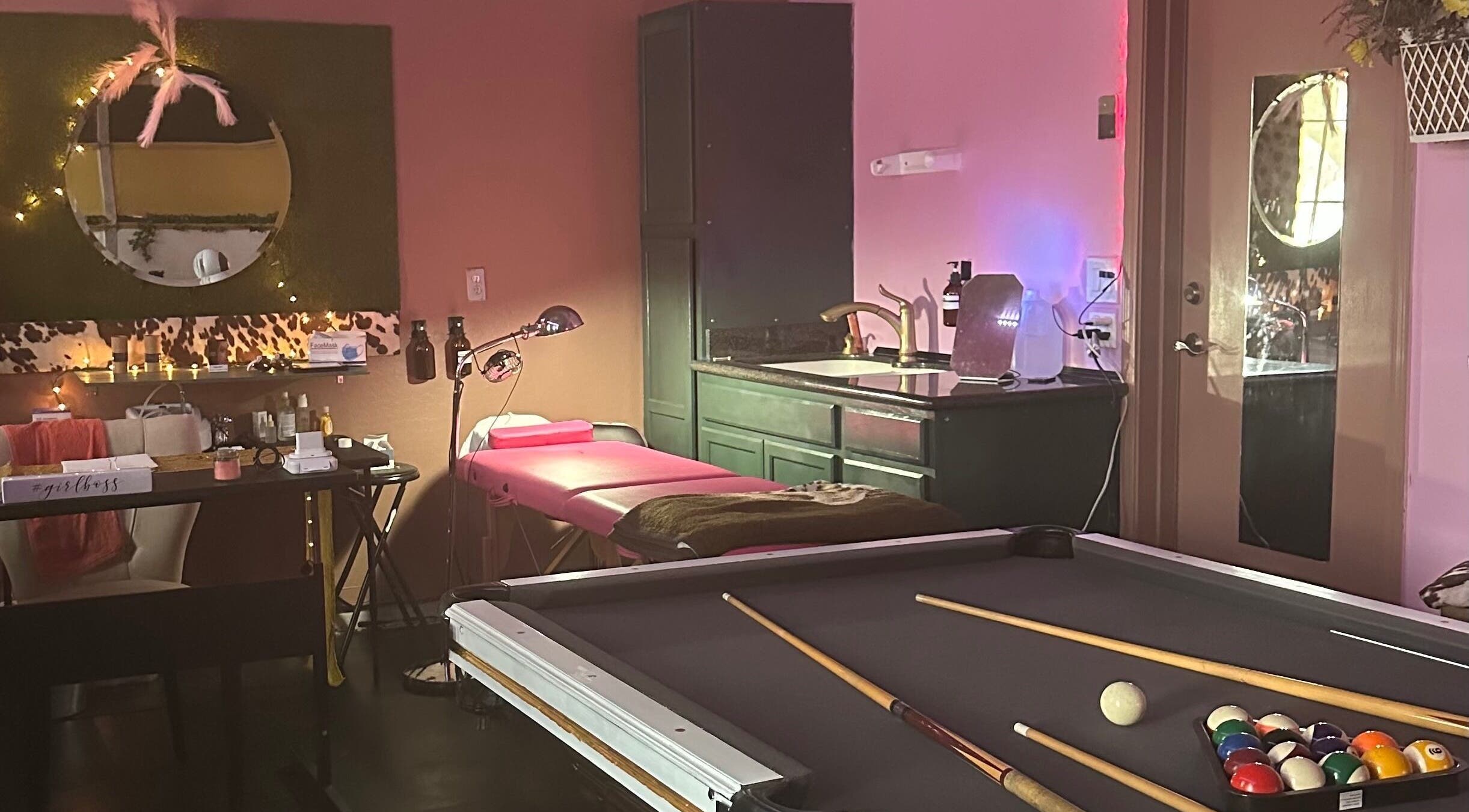 Cozy beauty room at Naturally 21 Skin & Beauty in Surprise, Arizona, US, featuring a treatment bed and mirror.