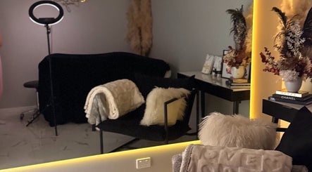 Relaxing interior of Gold Lash Lounge in Osborne Park, Western Australia, AU, featuring plush seating and chic decor.