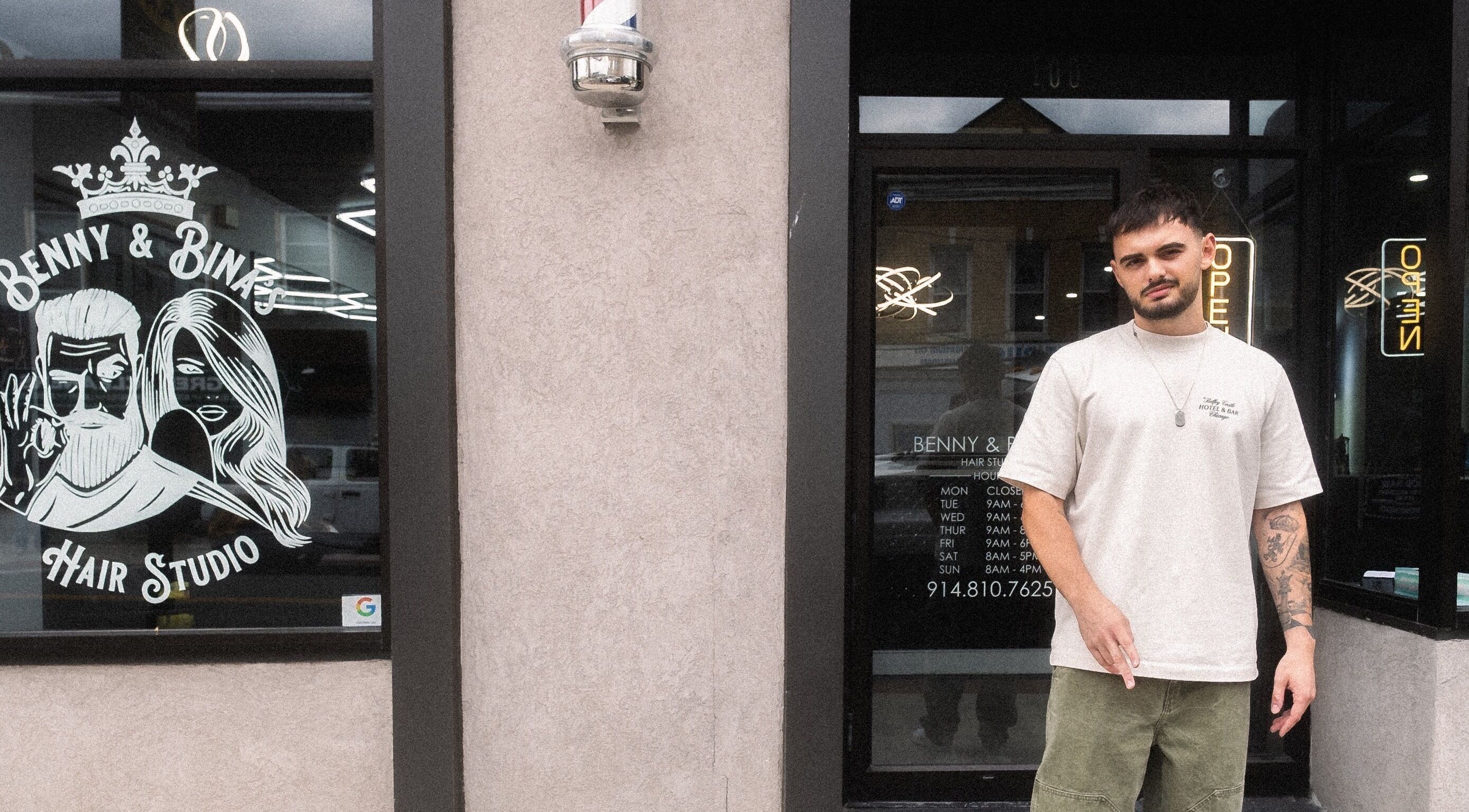 Exterior view of Benny & Bina’s Hair Studio in Dobbs Ferry, New York, US with a person standing outside.
