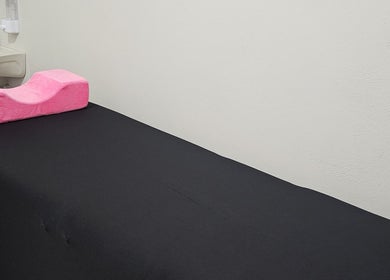 Massage table at Snatched Contour, Porus, Manchester Parish, JM with pink cushion for comfort.