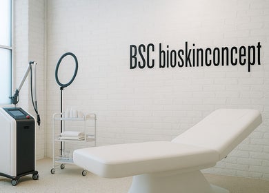 Modern spa room at bioskinconcept, Toronto, Ontario, CA, featuring a treatment bed and equipment.