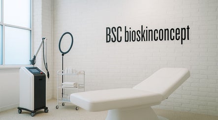 Modern spa room at bioskinconcept, Toronto, Ontario, CA, featuring a treatment bed and equipment.