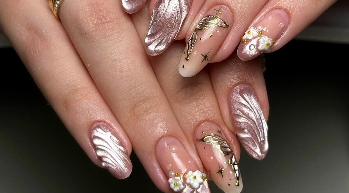Intricate nail art design at laDiri Nails, București, București, RO. Features shimmering pink and gold accents.