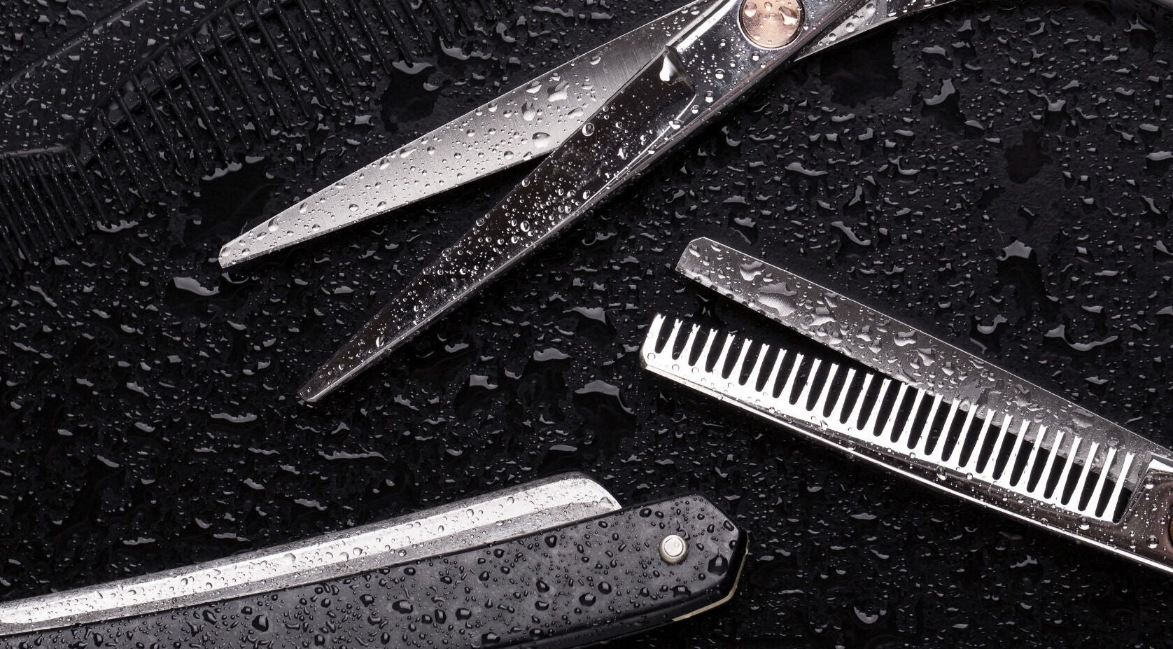 Professional barber tools at Tom & Jerry's Barbershop, Geelong, Victoria, AU, showcasing scissors and razor.