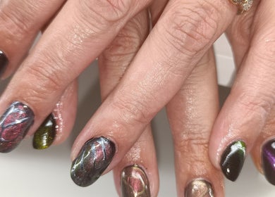 Intricate nail art at The Braless Nail Artist in Crestmead, Queensland, AU, showcasing unique colorful designs.
