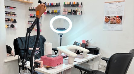 Inside Nailed by Alori, Luton, England, GB with elegant nail polish displays and a modern workspace.