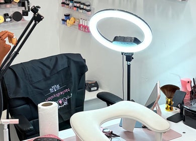 Nailed by Alori salon workspace in Luton, England, GB with manicure tools and lighting equipment.