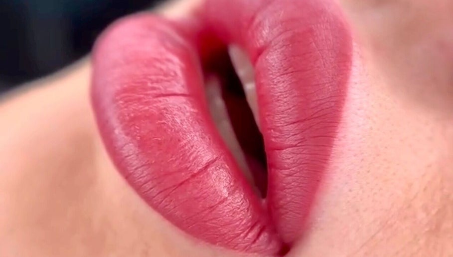 Close-up of vibrant lip color application at Micro Glow PMU, London, England, GB.