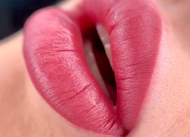 Close-up of vibrant lip color application at Micro Glow PMU, London, England, GB.