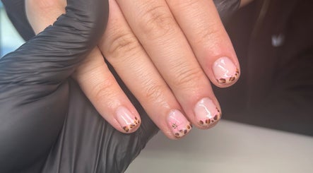 Elegant nail art design at Beautbynatz, Bathgate, Scotland, GB, showcasing leopard print tips.