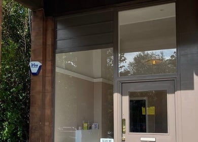 Main entrance of Moda, a beauty and wellness venue in Edinburgh, Scotland, GB with large glass windows.