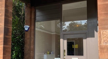 Entrance of Moda beauty venue, showcasing wooden details in Edinburgh, Scotland, GB.