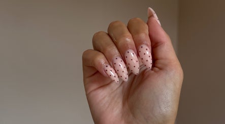 Close-up of stylish polka dot nails at Moda, Edinburgh, Scotland, GB. Perfect nail art finish.