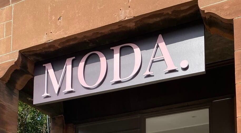 Moda's sleek sign in Edinburgh, Scotland, GB, showcases elegant design and style.