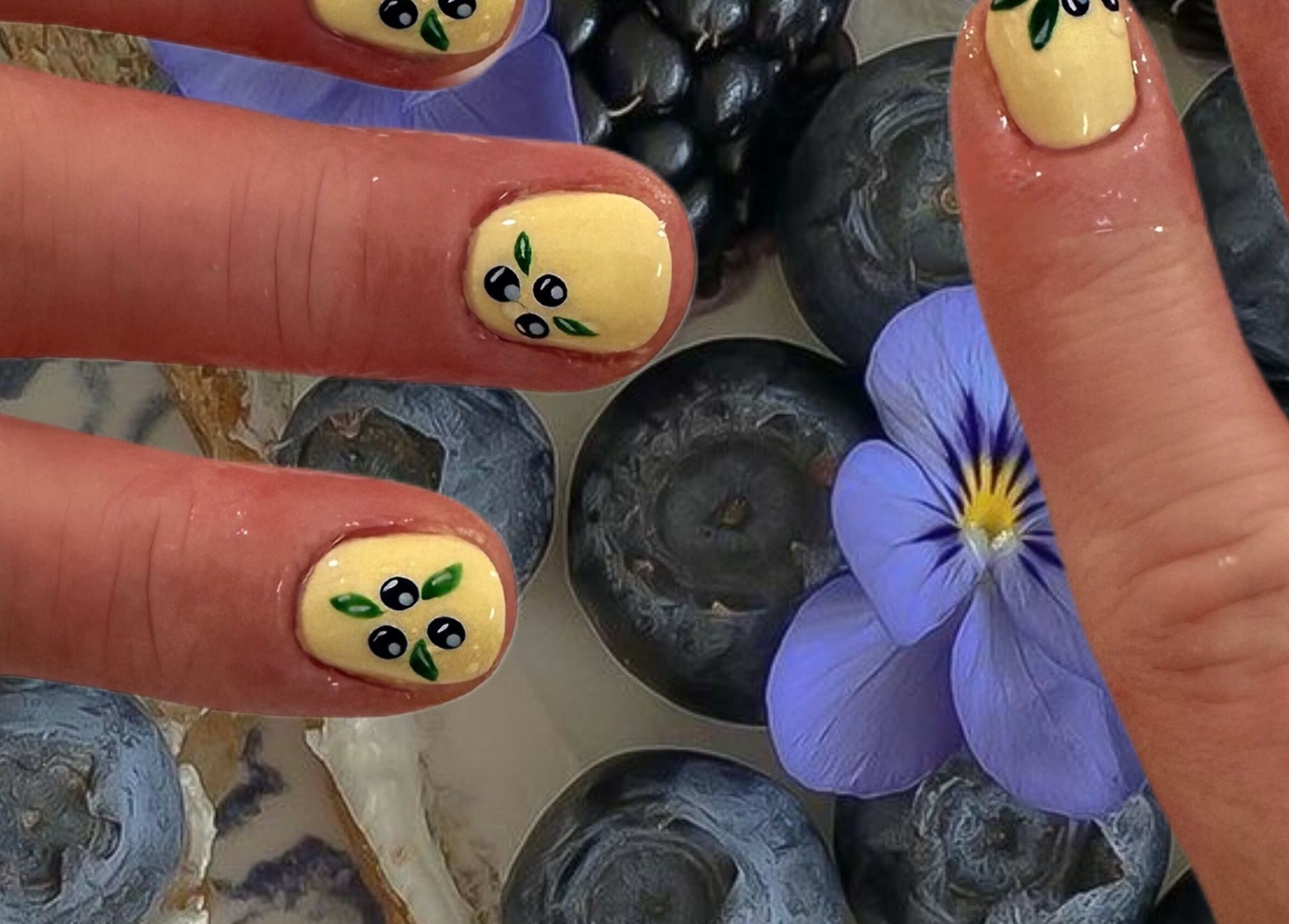 Artistic yellow nail design with floral and berry theme at Your Local Nail Lady, Warners Bay, New South Wales, AU.