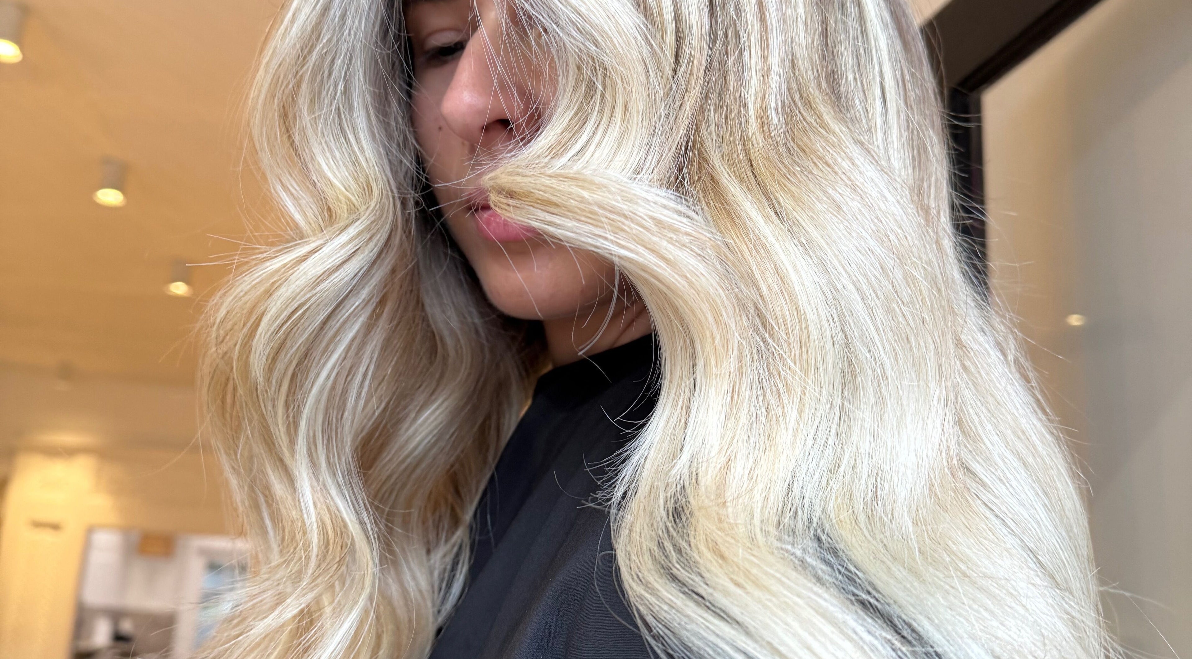 Stylish blonde waves at Sinead Murphy Hair in Cottesloe, Western Australia, AU.