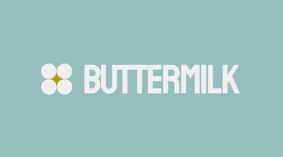 Buttermilk Salon logo in Dundee, Scotland, GB with a soothing teal background.