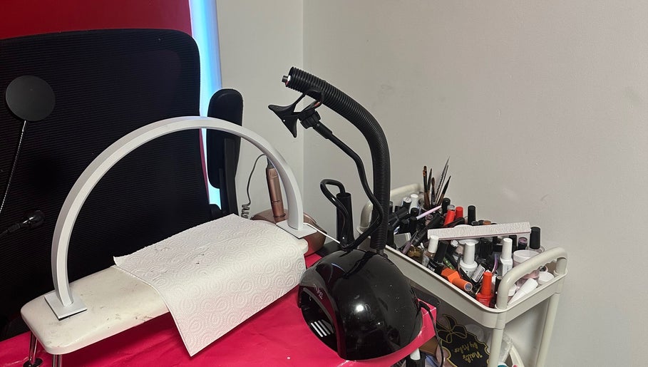 Elegant nail station at NailsbyAsher in Coventry, England, GB with tools and polish for manicures.