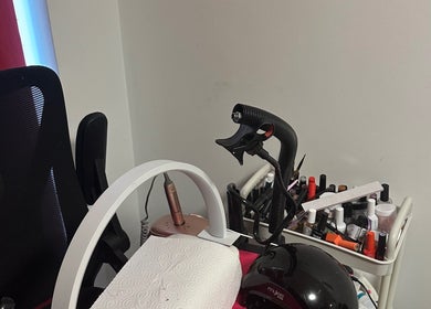Nail care station at NailsbyAsher in Coventry, England, GB, showcasing tools and polish collection.